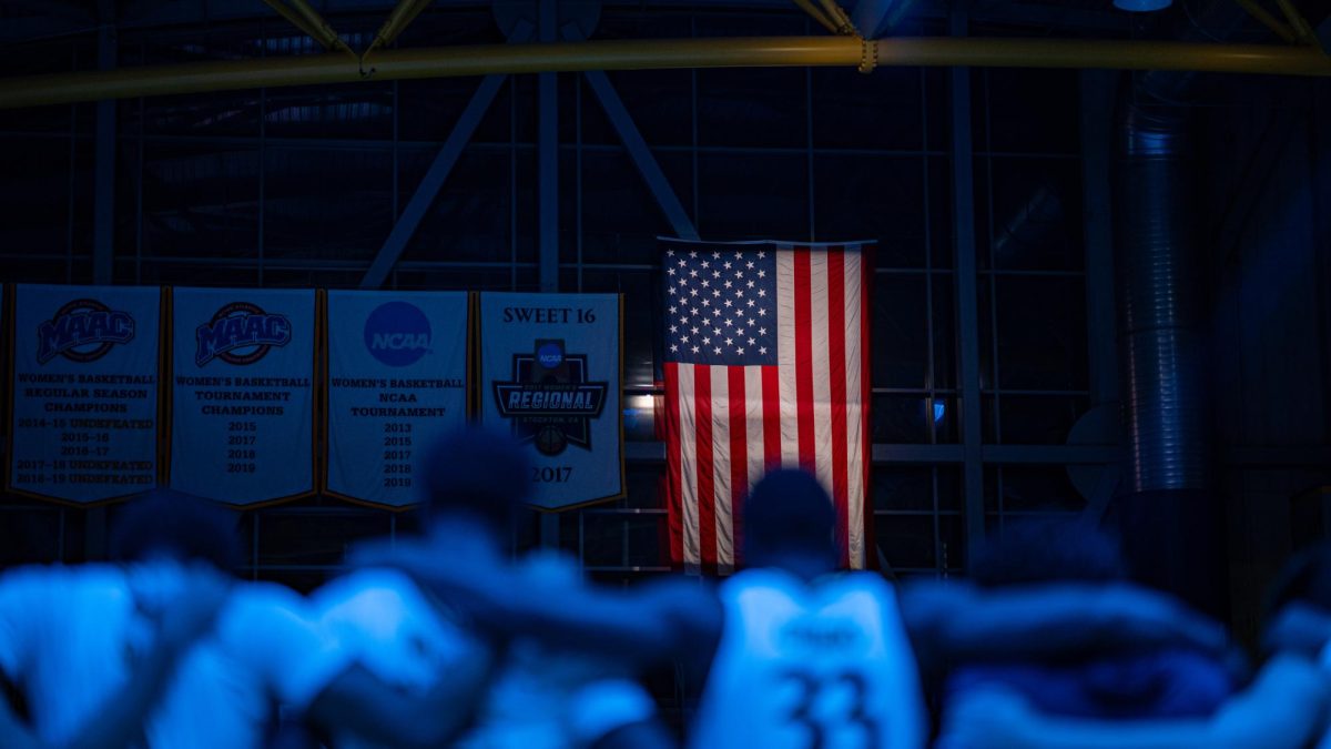 Quinnipiac men's basketball stands together for the National Anthem before taking on WPI on Nov. 17.