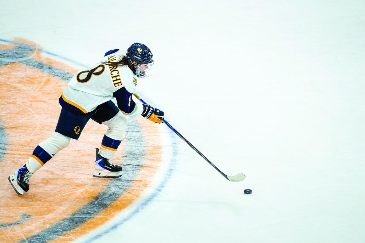 Junior forward Kahlen Lamarche skates down center ice against UConn on Sept. 20.