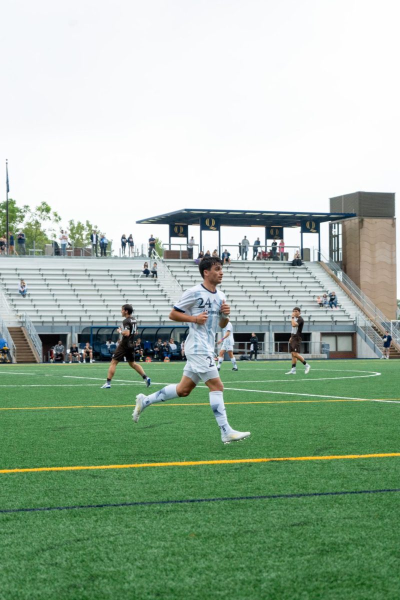 Graduate student midfielder Drew Seguro runs on field against St. Bonaventure on Sept. 7, 2024. 