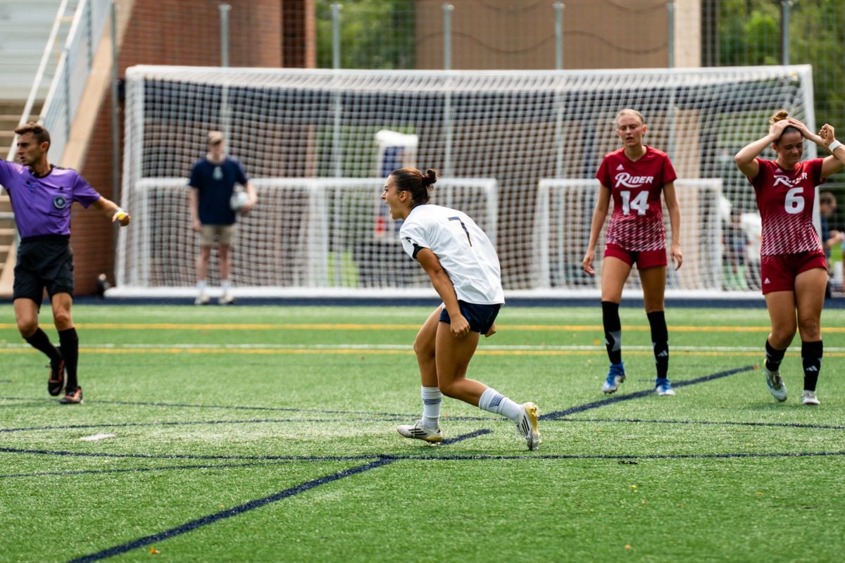 Senior forward Milena Branco celebrates after tying with Rider 1-1.
