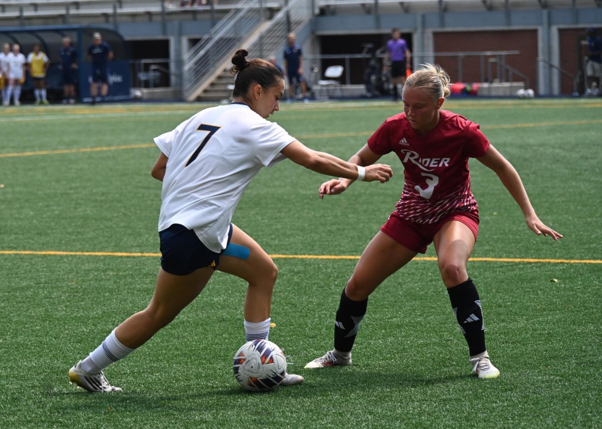 Senior forward Milena Branco battles against Rider defender on Sept. 6.