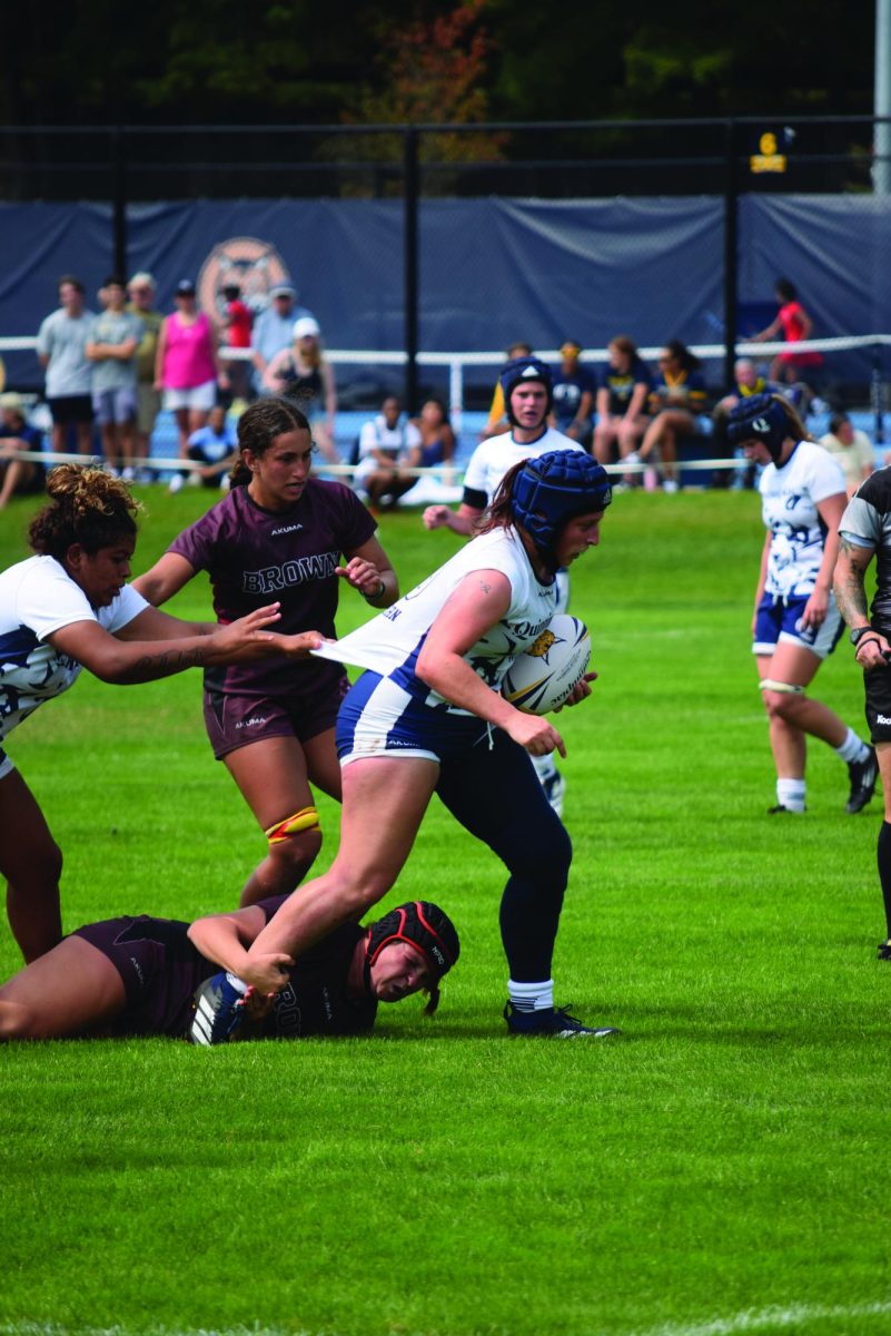Senior hooker Lucy Lamborn attempts to escape tackle from Brown defense on Sept. 6.
