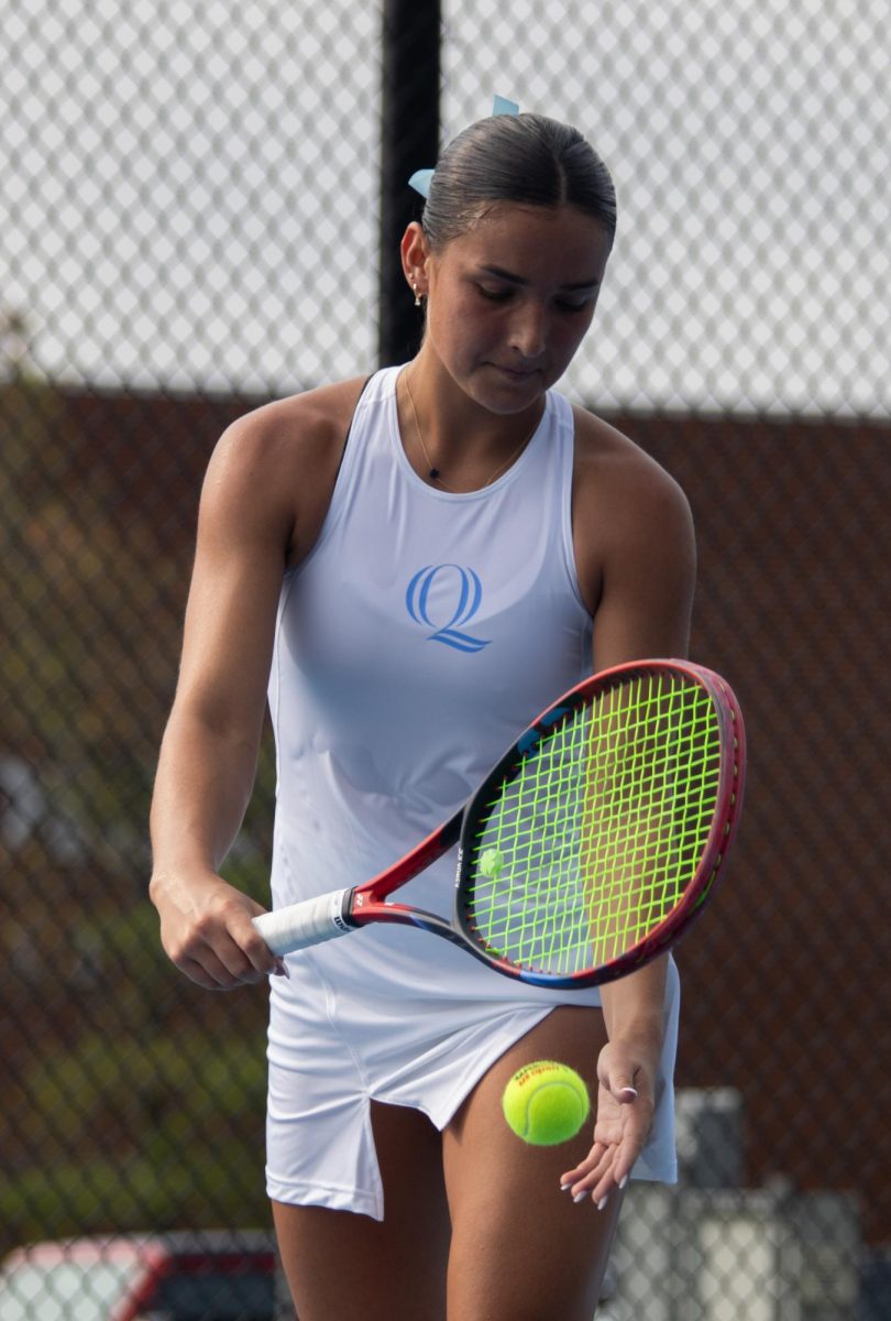 Sophomore Willow Renton gets ready to serve against UConn on Sept. 6. 