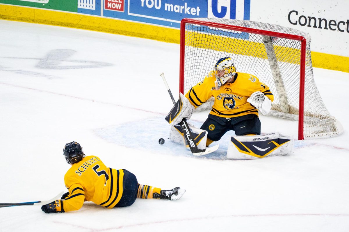 Junior goaltender Matej Marinov makes save against Maine on Oct. 17.