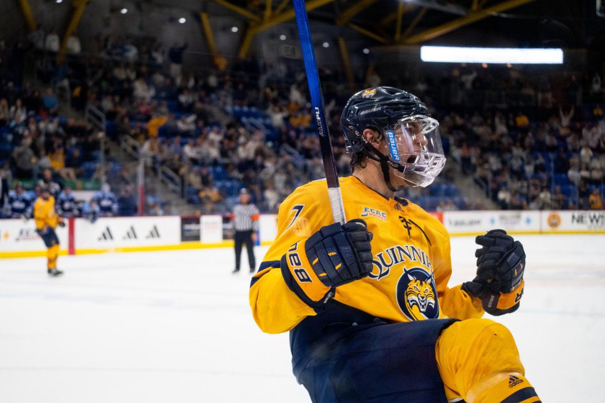 Sophomore defenseman Elliot Groenewold celebrates after scoring Quinnipiac's third goal to help the Bobcats come back and tie Maine 4-4 on Oct. 17.