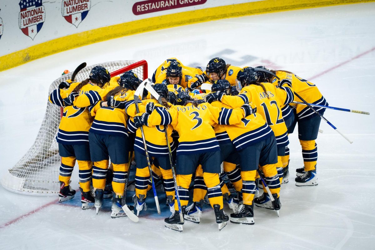 Quinnipiac women's ice hockey huddles up before taking on the University of Maine on Sept. 26.