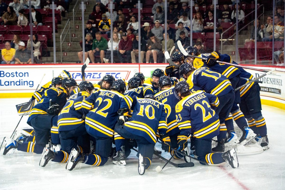 Quinnipiac men's ice hockey huddles before taking on Boston College on Oct. 3. 