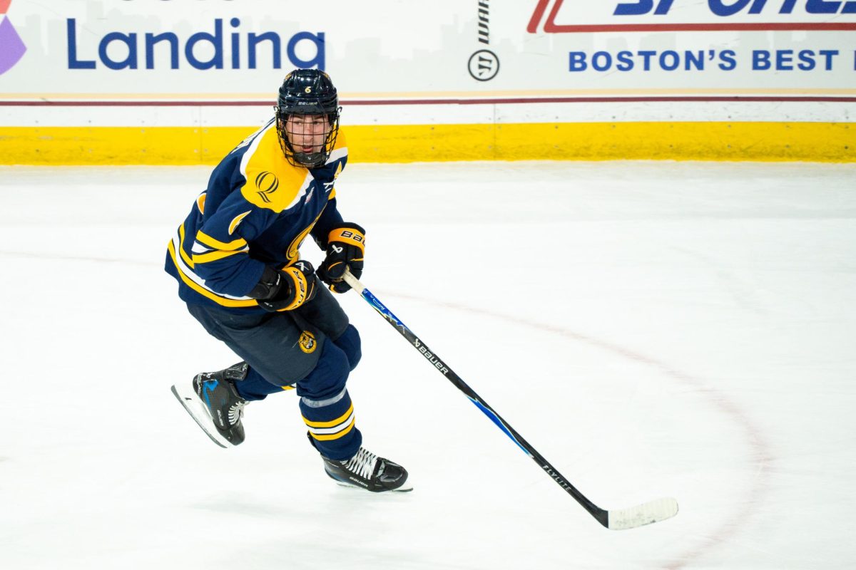 Senior defenseman Charlie Leddy skates down ice against Boston College on Oct. 3.