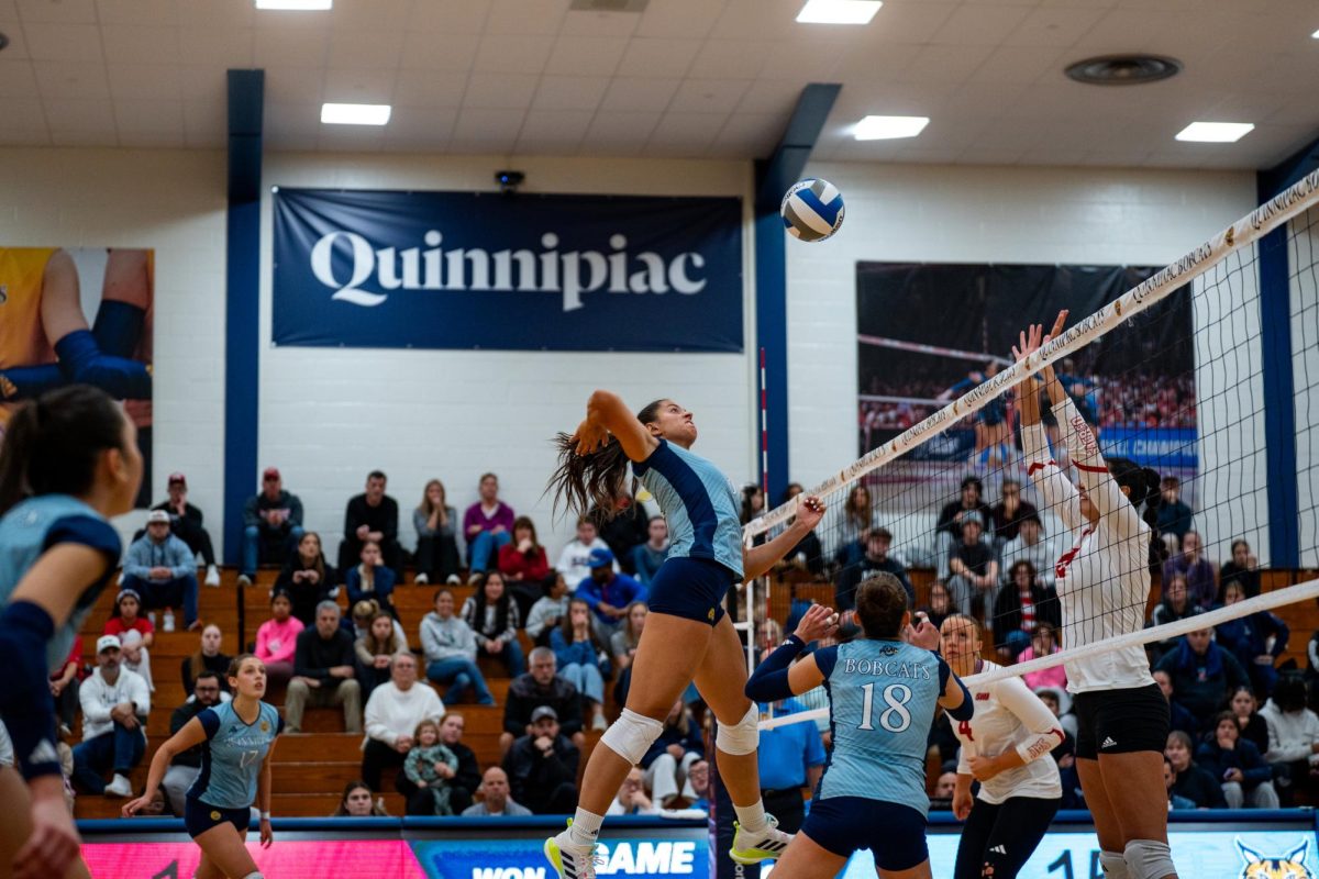 Senior middle blocker Milena Silva attacks against Sacred Heart on Oct. 25.