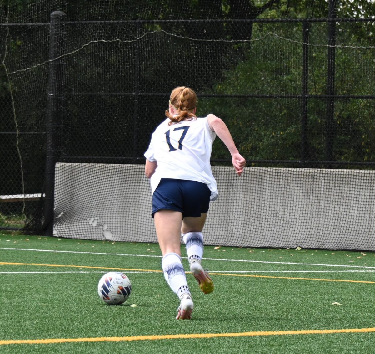 Freshman defenseman Corey Anderson dribbles down field against Rider on Sept. 6.