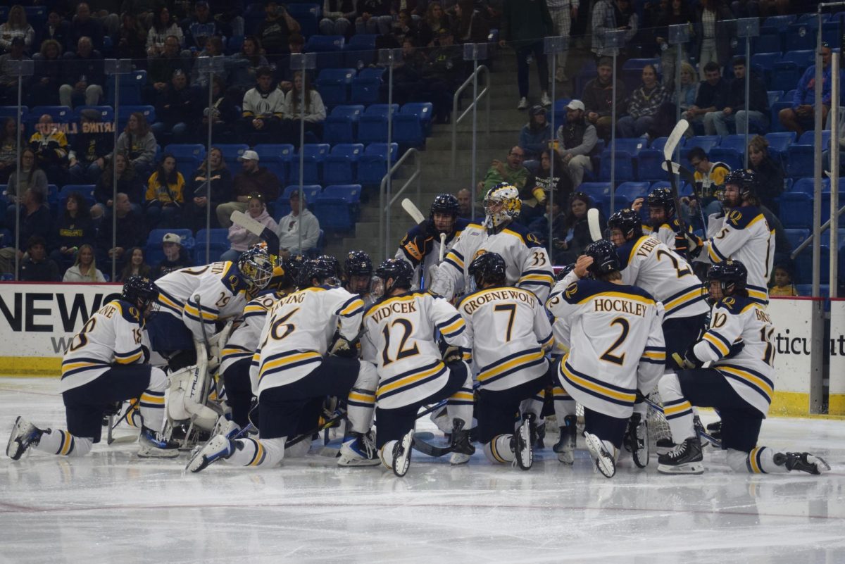 Quinnipiac men's ice hockey huddles before taking on UMaine on Oct. 18.