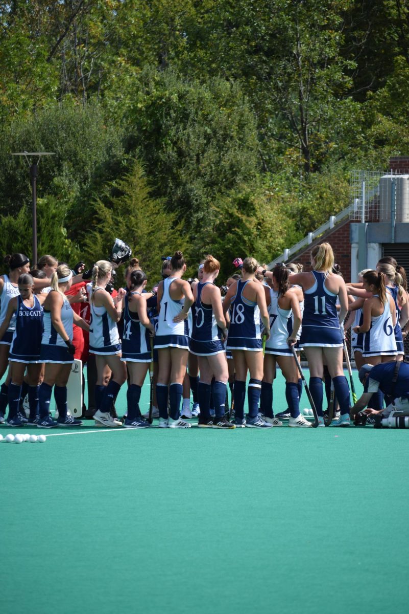 Quinnipiac field hockey huddles up against Liberty on Sept. 21.