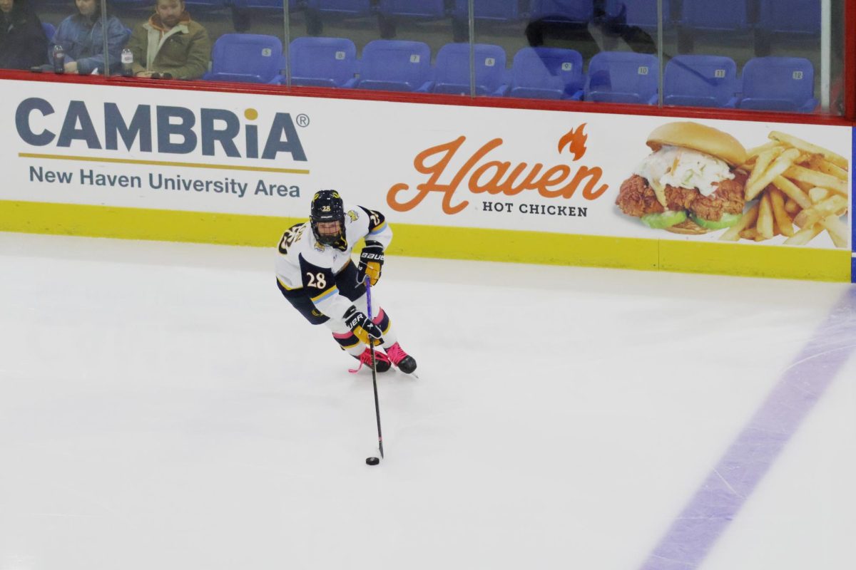 Sophomore defensemen Makayla Watson skates in the Friar's zone during Quinnipiac's 5-0 shutout. 