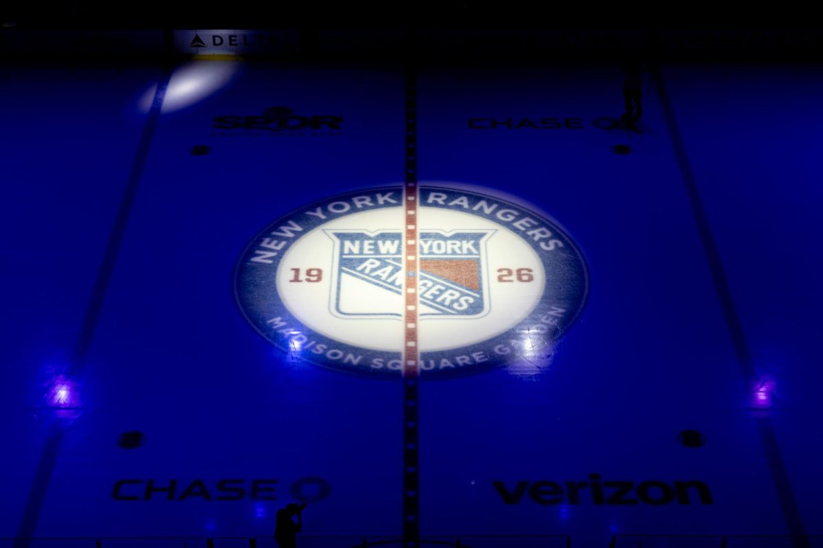 The New York Rangers logo illuminates at center ice of Madison Square Garden before Quinnipiac men's ice hockey takes on Cornell at the Frozen Apple on Nov. 30.