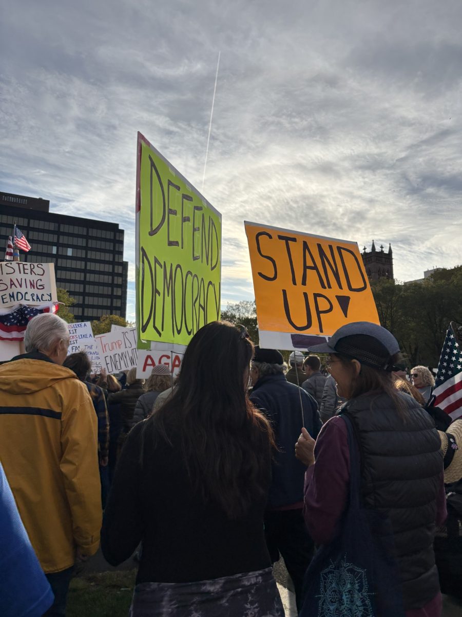 Protesters come together on the New Haven Green in New Haven, Connecticut, for the "No Kings" protest on Saturday, Oct. 18. 