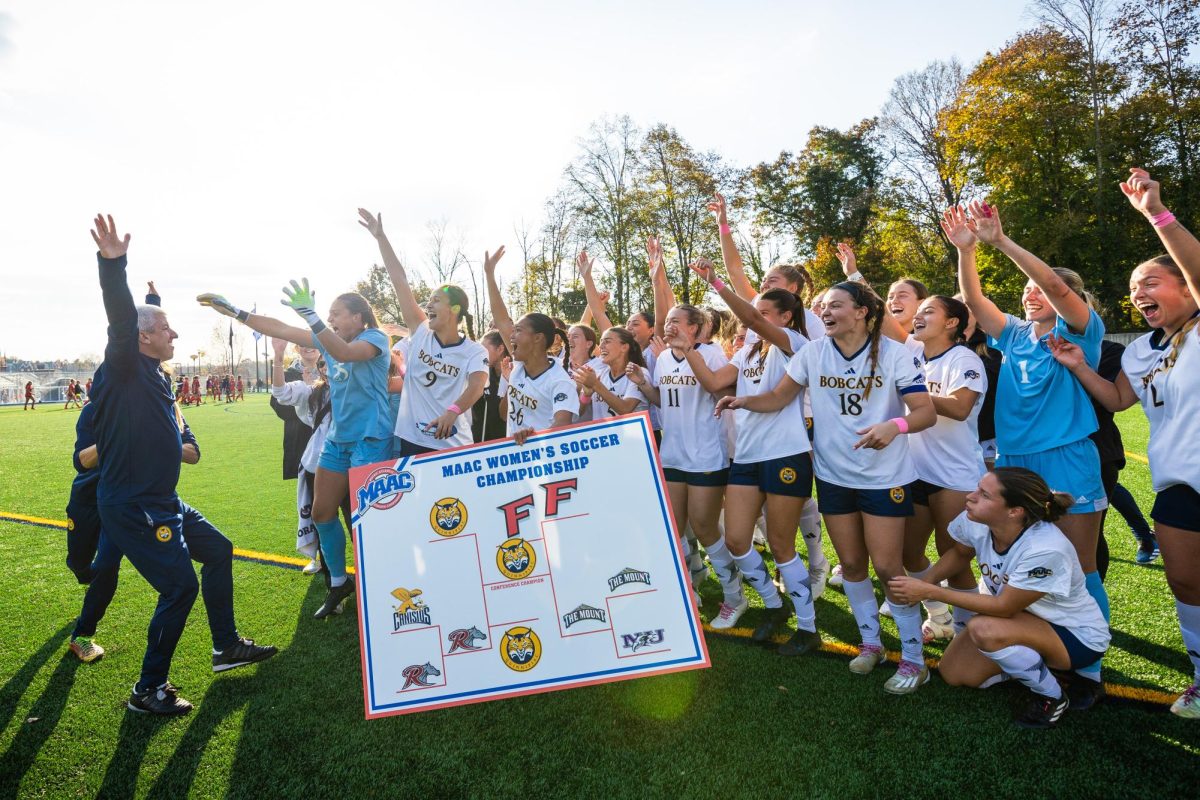 Dave Clarke celebrates back-to-back MAAC Championships with his squad in 2023.