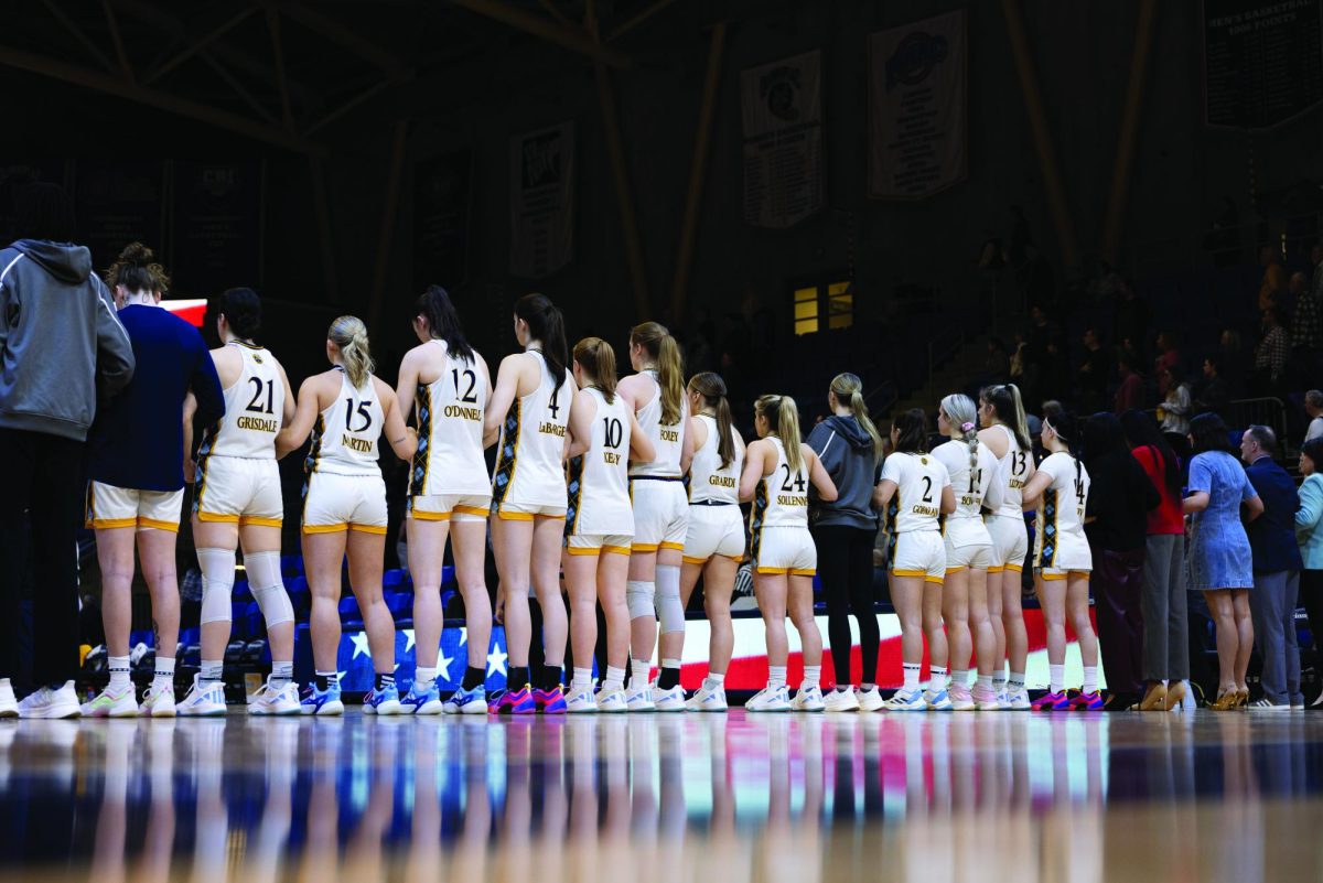 Quinnipiac women's basketball standing for the national anthem ahead of playing Merrimack on March 1.