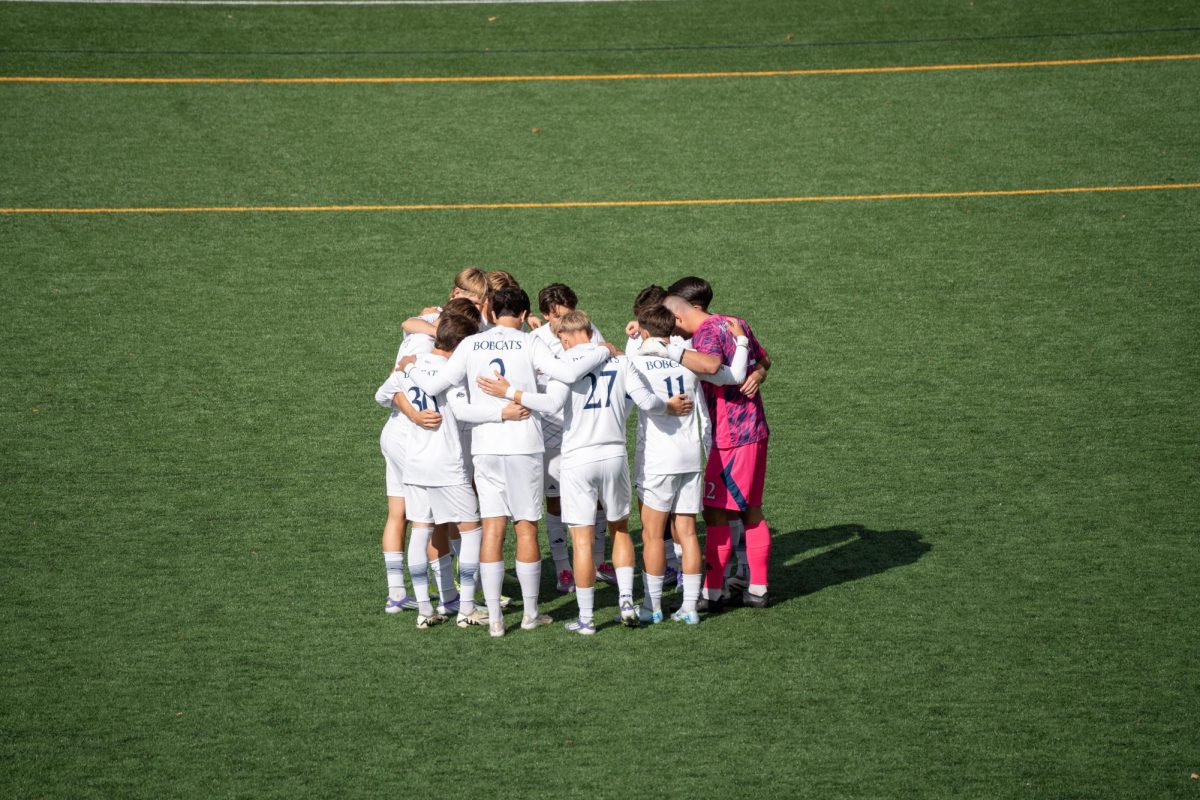 Quinnipiac men's soccer huddles up before a Oct. 25 matchup against Siena.