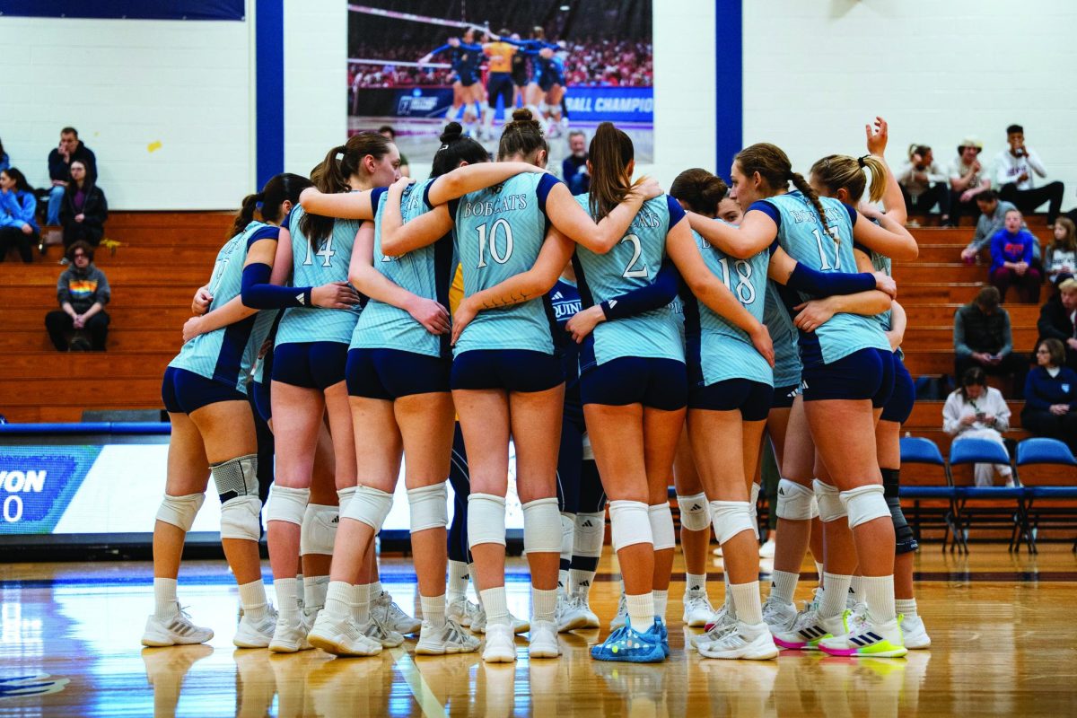Quinnipiac women's volleyball huddles against Manhattan on Nov. 1. 