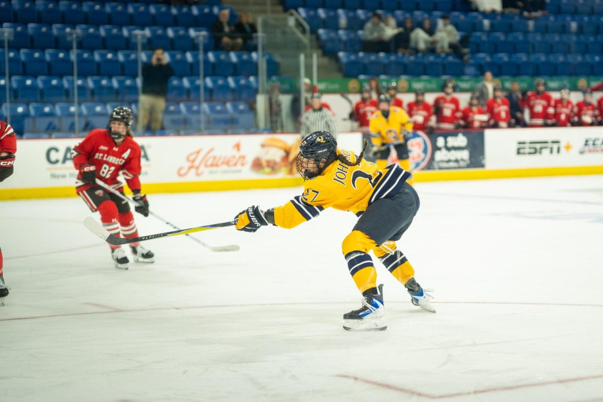 Freshman forward Ella Johnson takes a shot against St. Lawrence on Nov. 7.