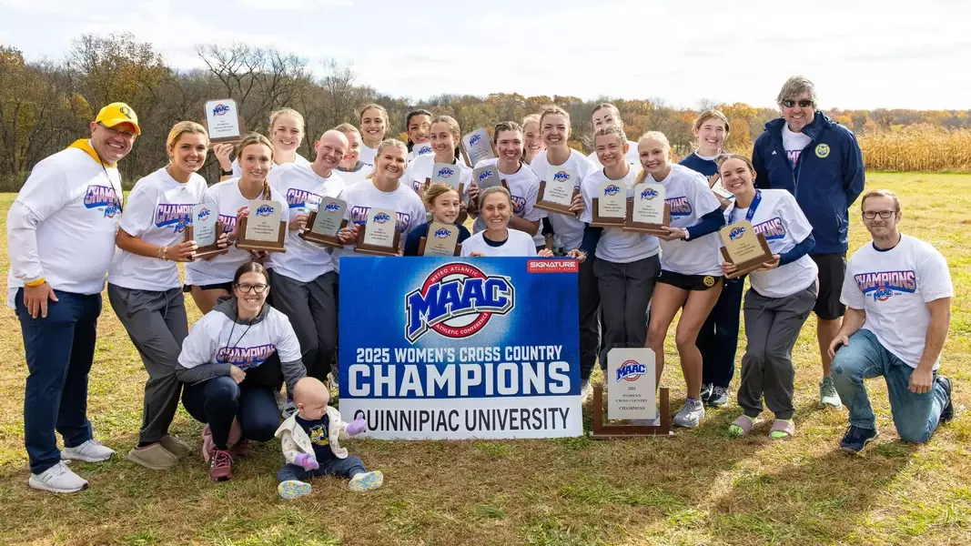Quinnipiac women's cross country celebrates after winning fourth consecutive MAAC Title. (Photo Courtesy of Quinnipiac Athletics)